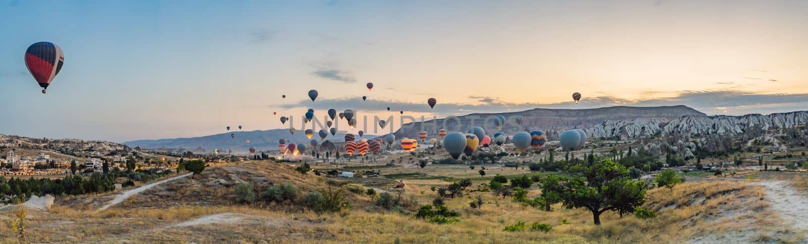 Colorful hot air balloon flying over Cappadocia, Turkey by galitskaya