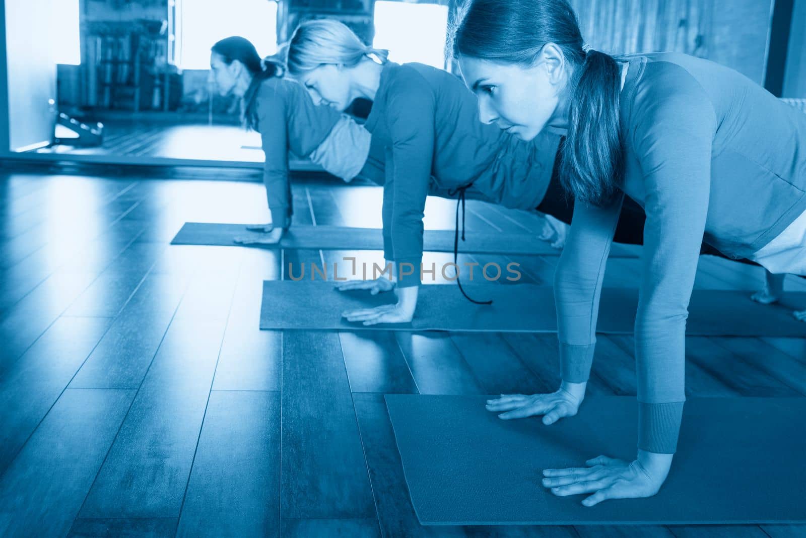 Yoga Class, Group of People Relaxing and Doing Yoga pose