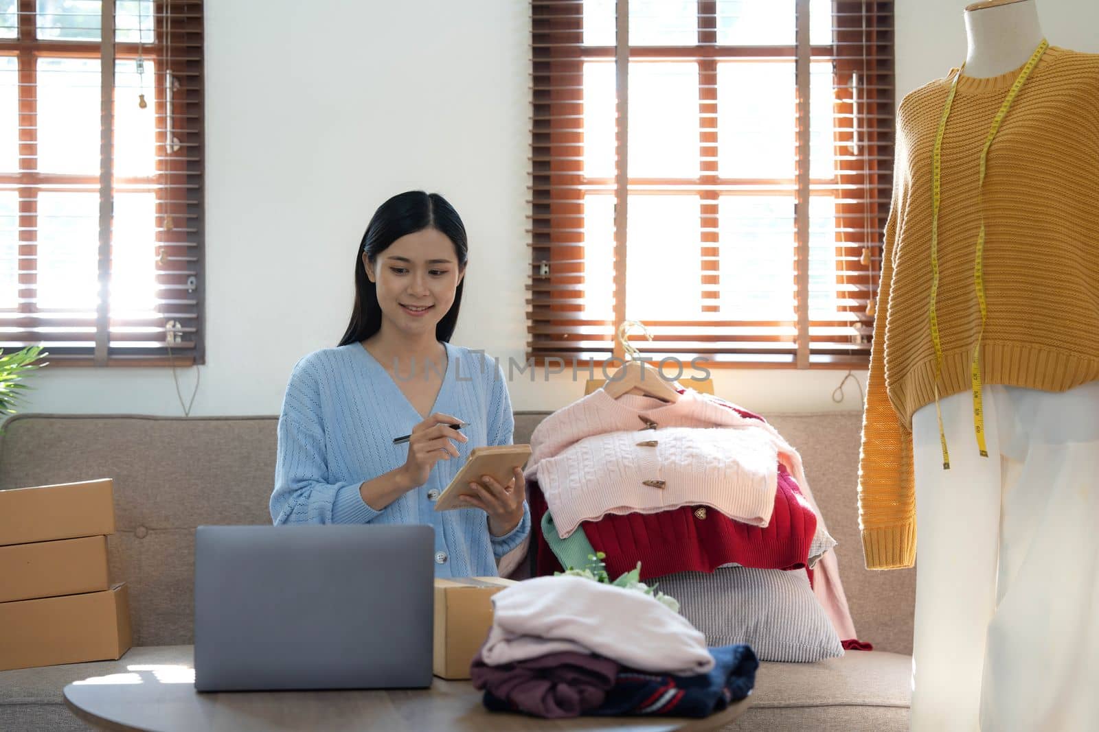 Startup small business entrepreneur SME, asian woman packing box. Portrait of young Asian small business owner in home office, online sell marketing delivery