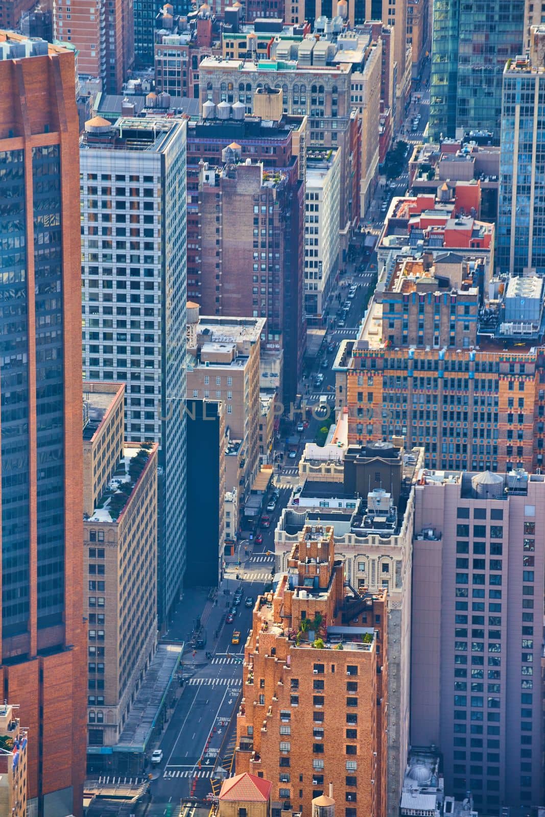 Image of Above New York City looking down street lined with skyscrapers