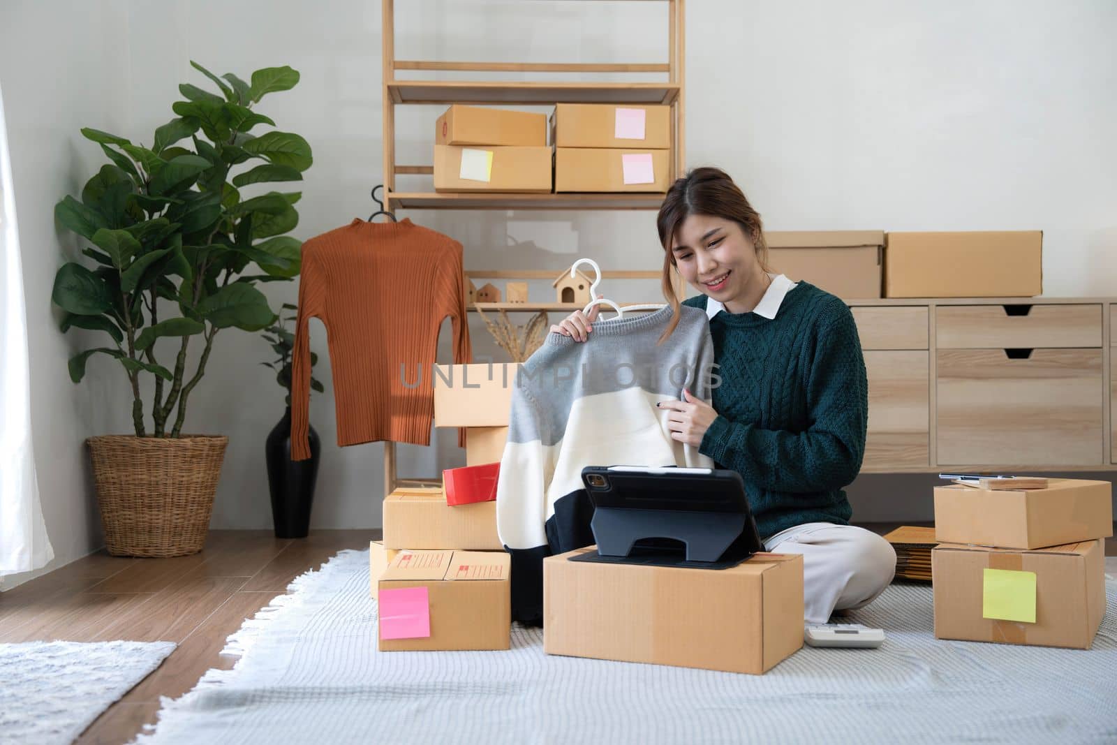 Online seller owner. Online shopping. Business Start up SME concept. Young startup entrepreneur small business owner working at home