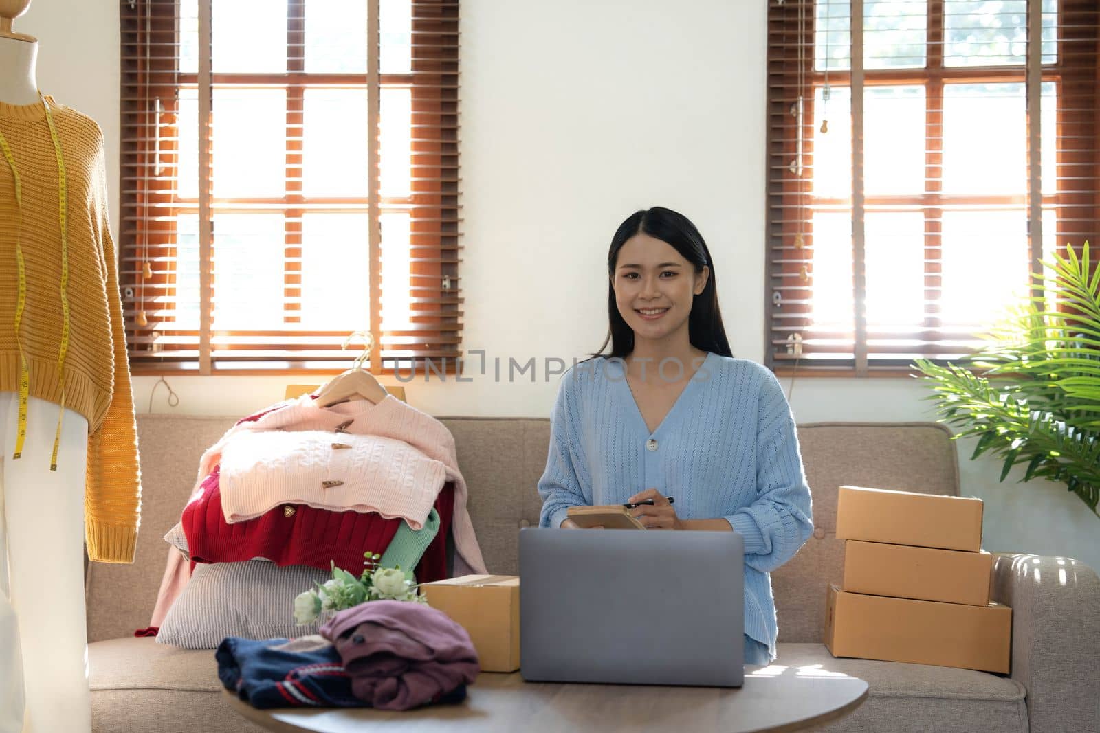Startup small business entrepreneur SME, asian woman packing box. Portrait of young Asian small business owner in home office, online sell marketing delivery