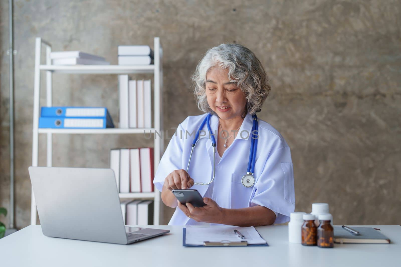 Doctor having conversation with patient while discussing explaining symptom and hold hand for encourage.