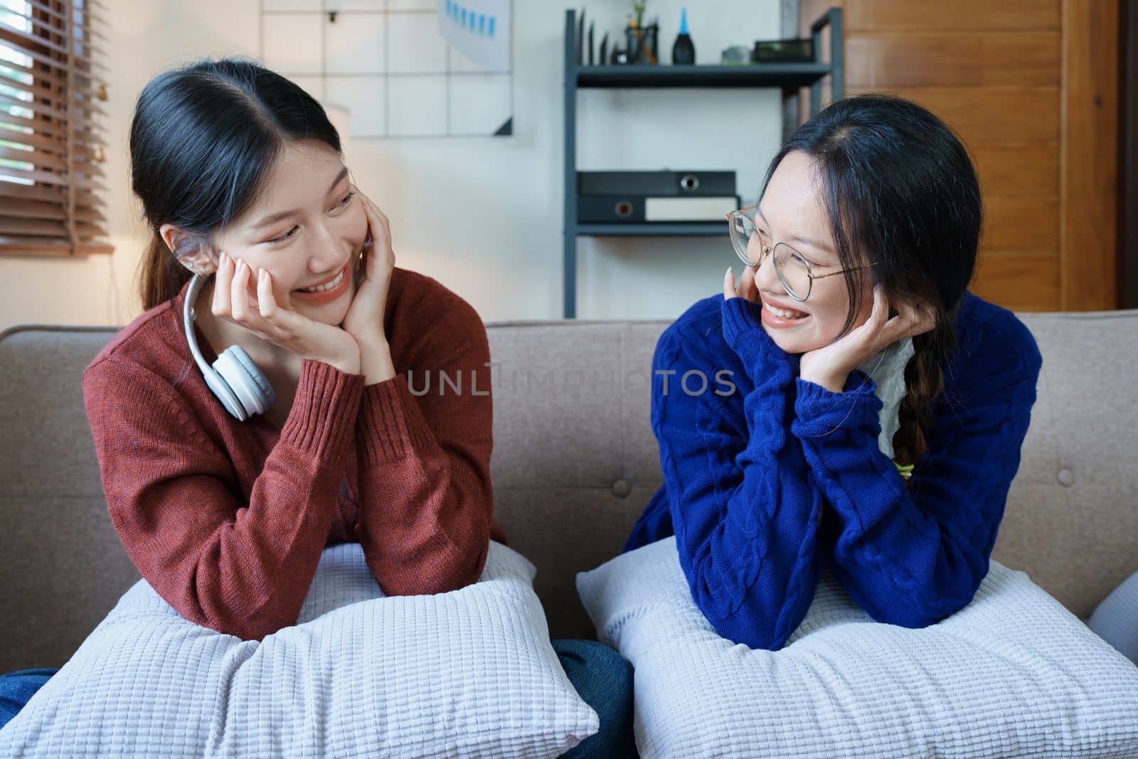 lgbtq, lgbt concept, homosexuality, portrait of two Asian women posing happy together and showing love for each other while being together by Manastrong