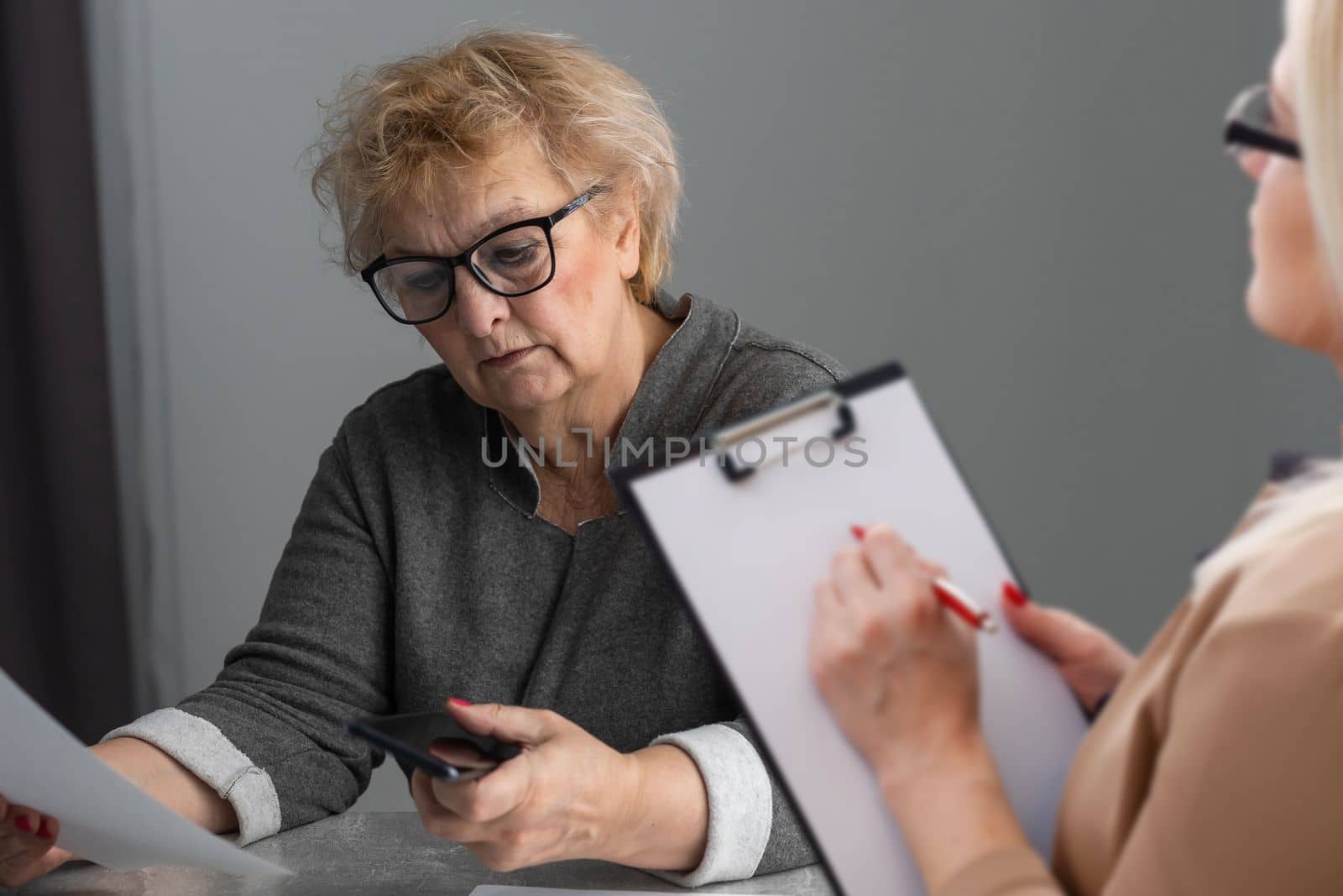 Parkinson and alzheimer female senior elderly patient with professional doctor consult in or counsel diagnosis health in hospital. Medical healthcare concept