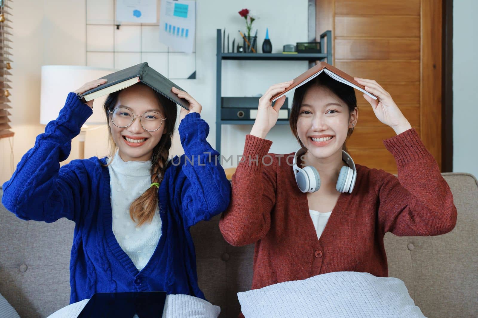 lgbtq, lgbt concept, homosexuality, portrait of two asian women posing happy together and loving each other while playing computer laptop with notebook for learning online.