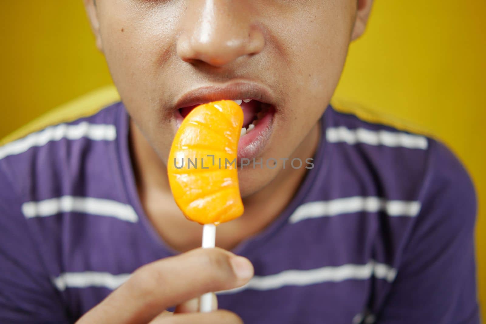  boy eating Lollipop close up ,