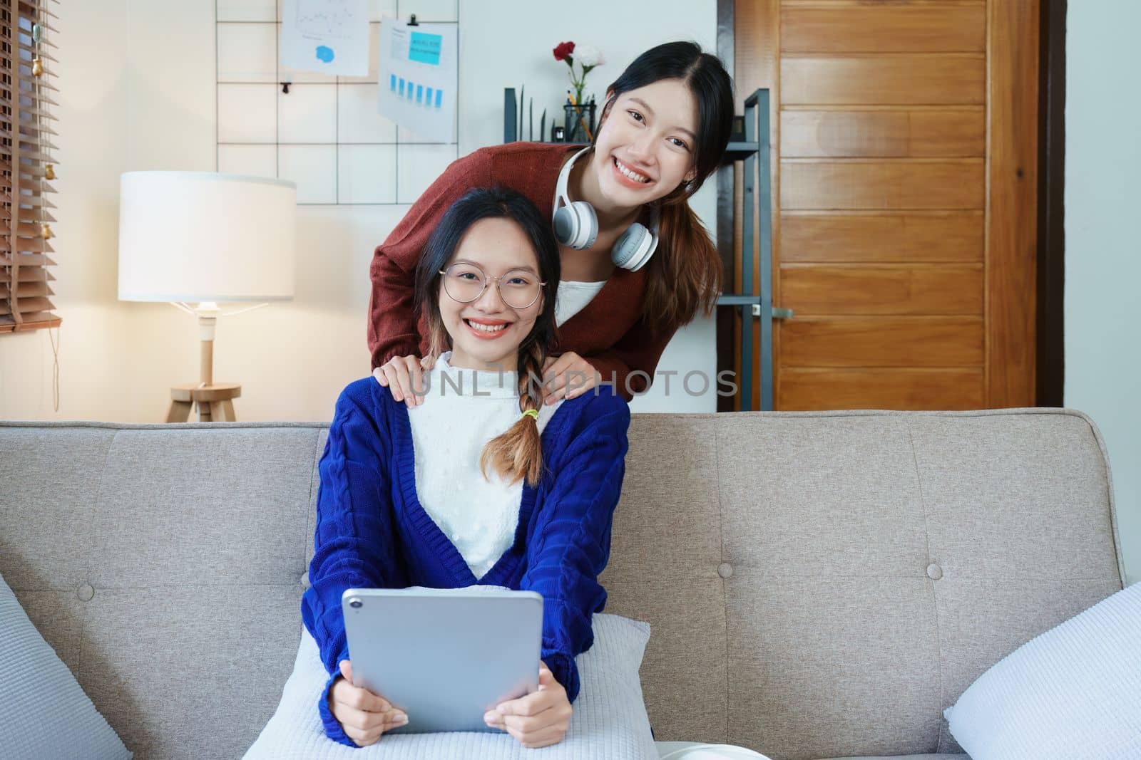 lgbtq, lgbt concept, homosexuality, portrait of two asian women enjoying together and showing love for each other while using tablet.