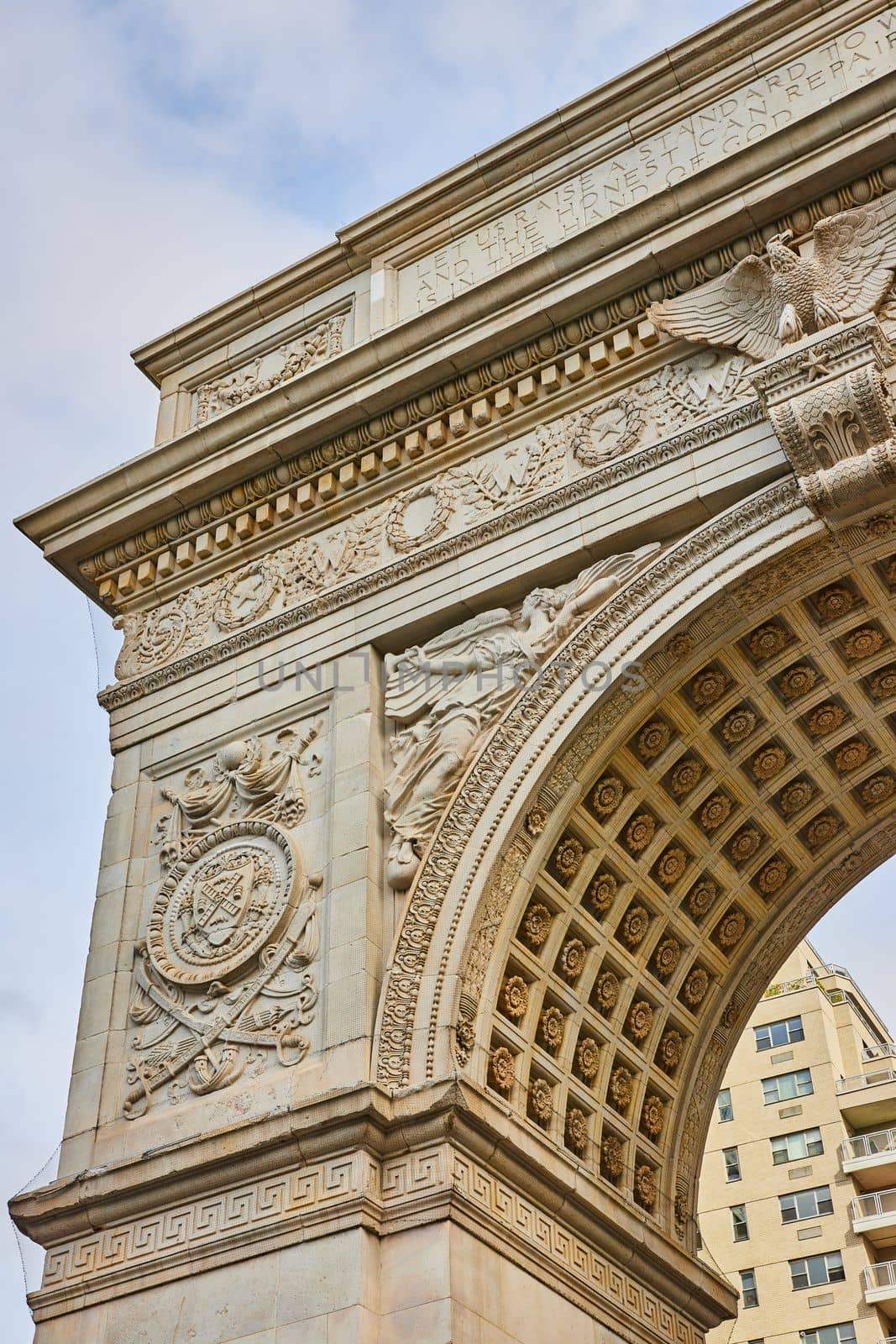 Image of Detail of top corner of limestone Washington Square Park arch in New York City