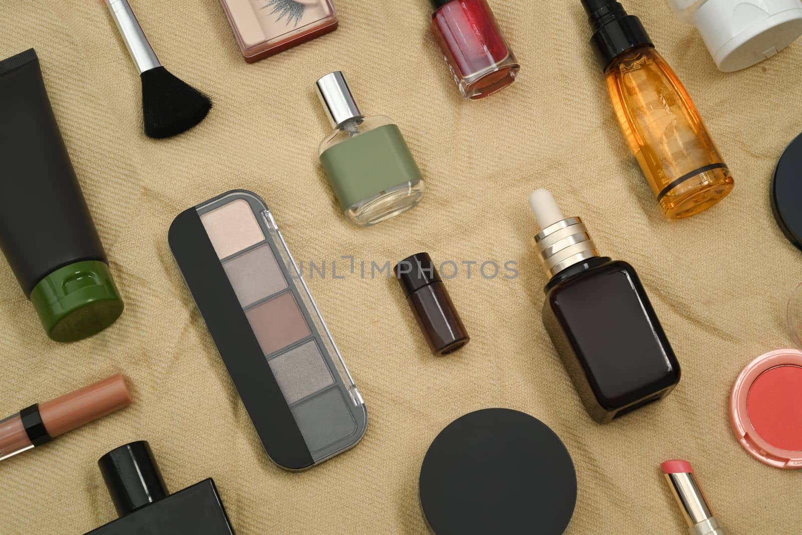 Various cosmetic products set on beige background. Skincare beauty products design and branding.