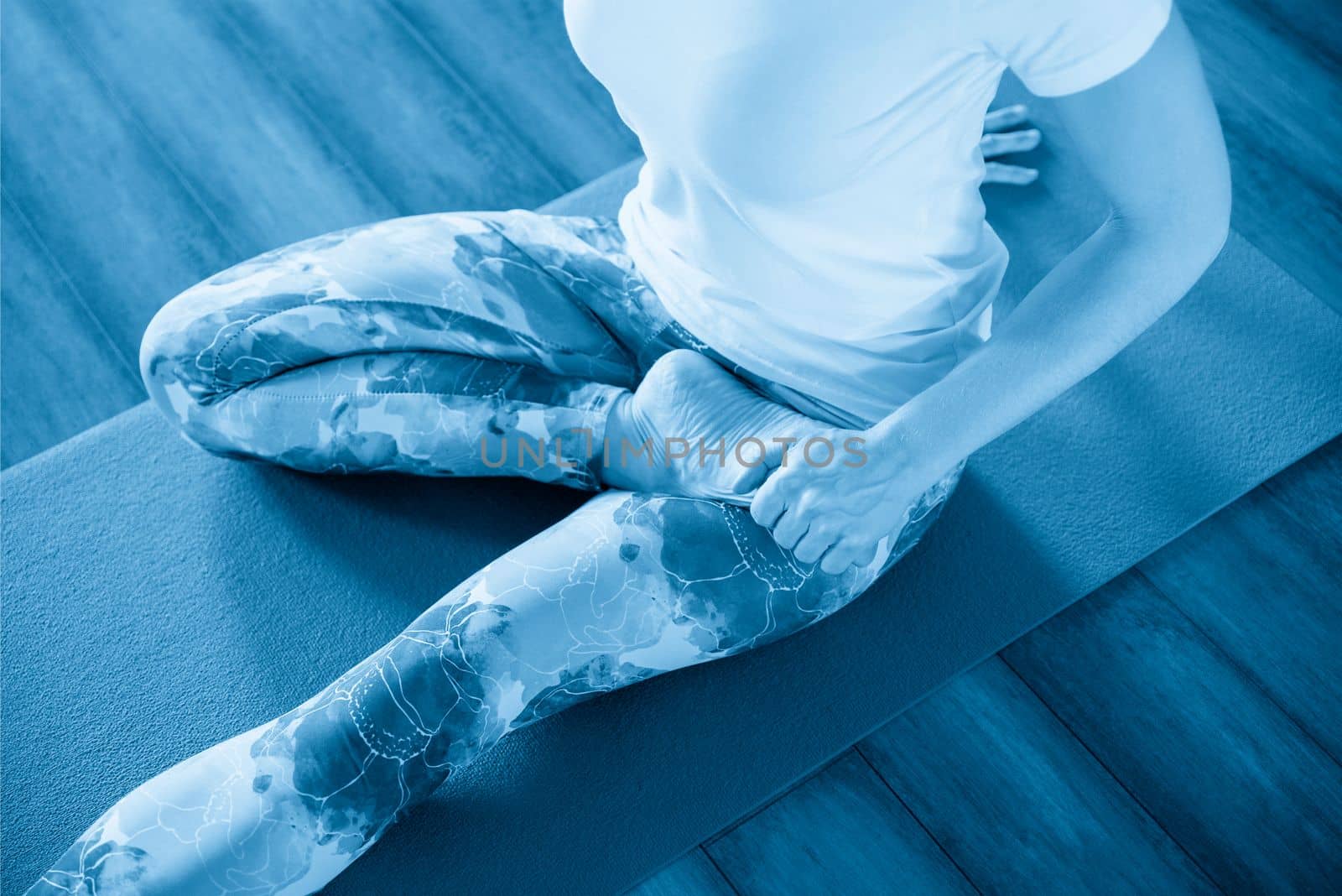 fitness, sport, training and lifestyle concept - woman stretching on mat in gym by Mariakray