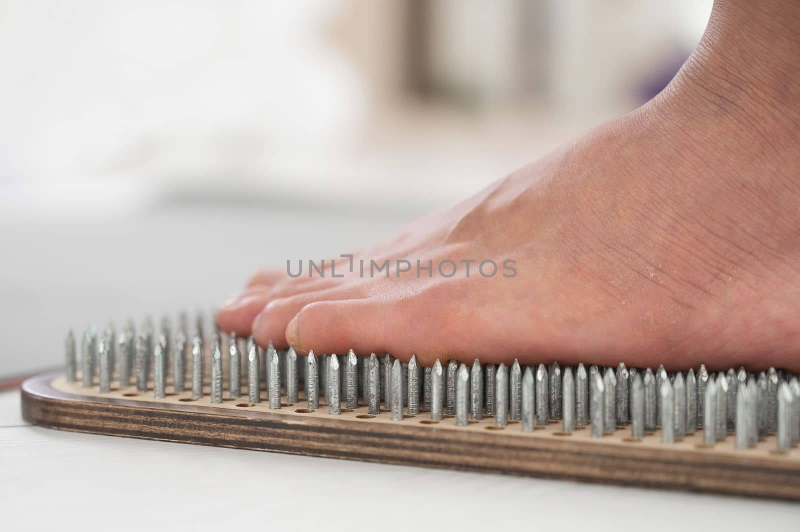 Close-up of female feet on sadhu boards