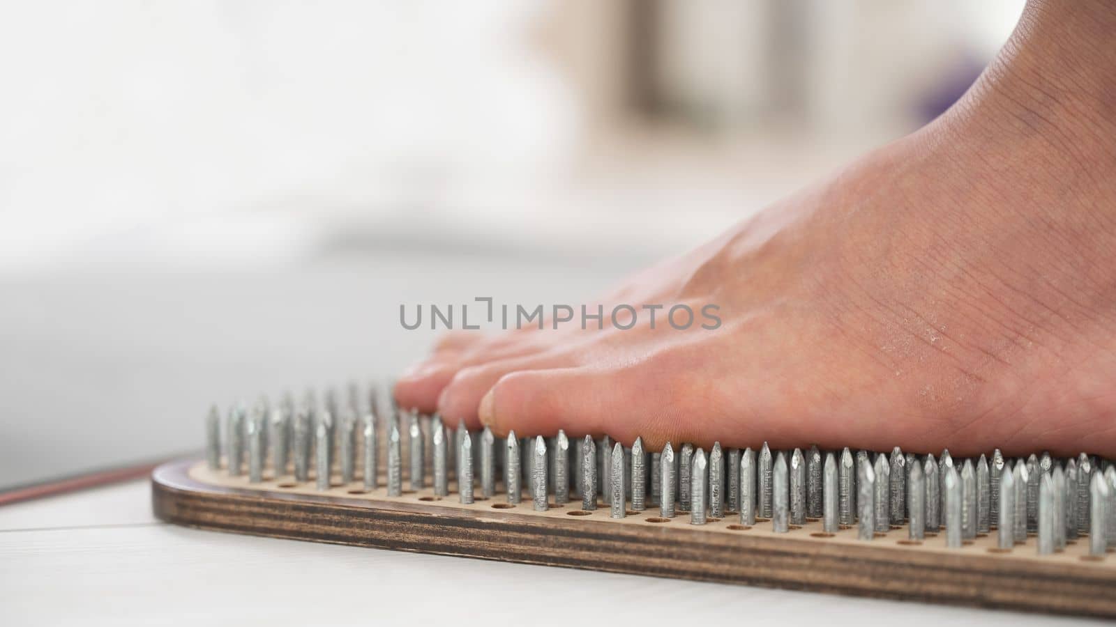 Close-up of female feet on sadhu boards