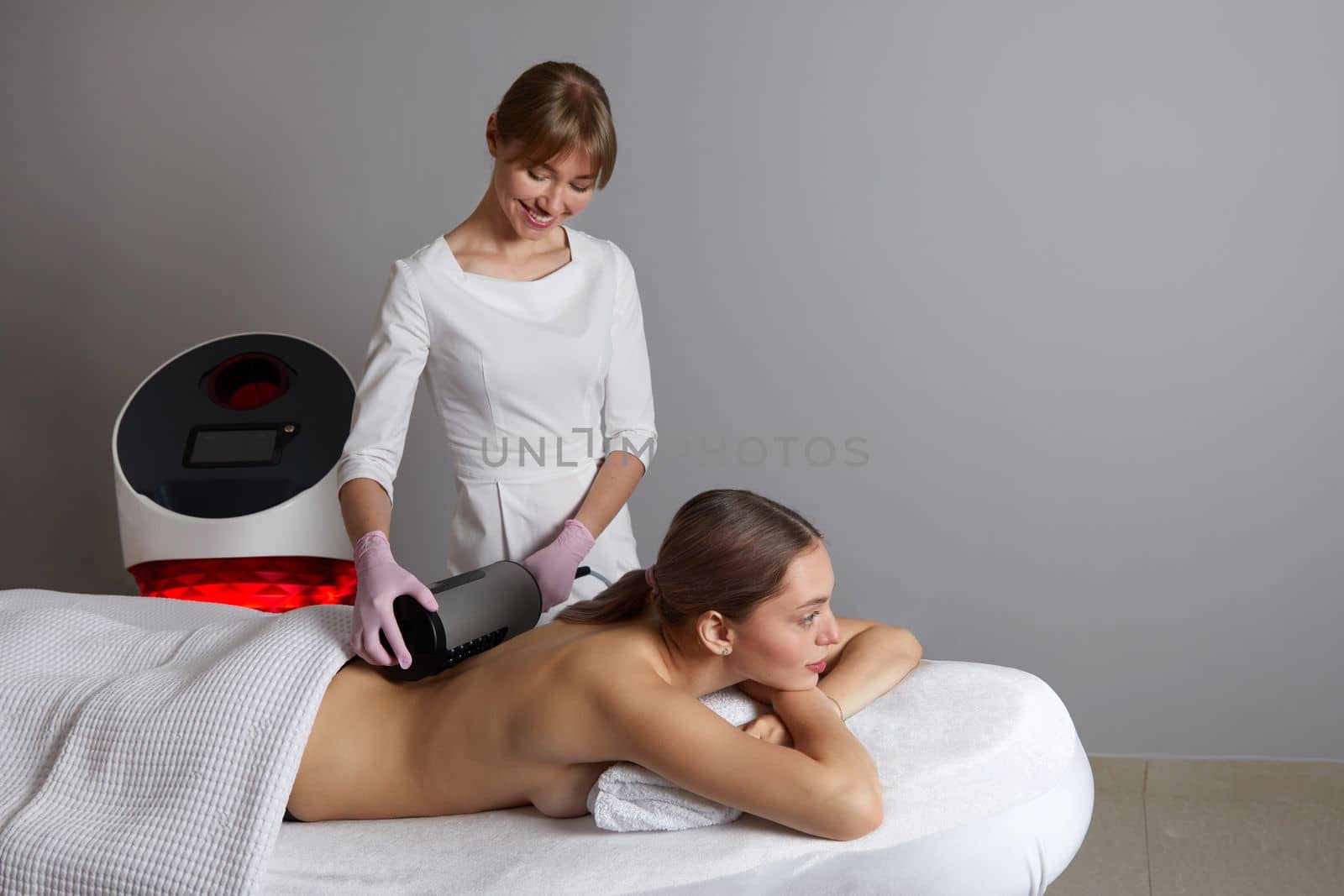 Endosphere therapy of female body by cosmetologist in beauty salon by Mariakray