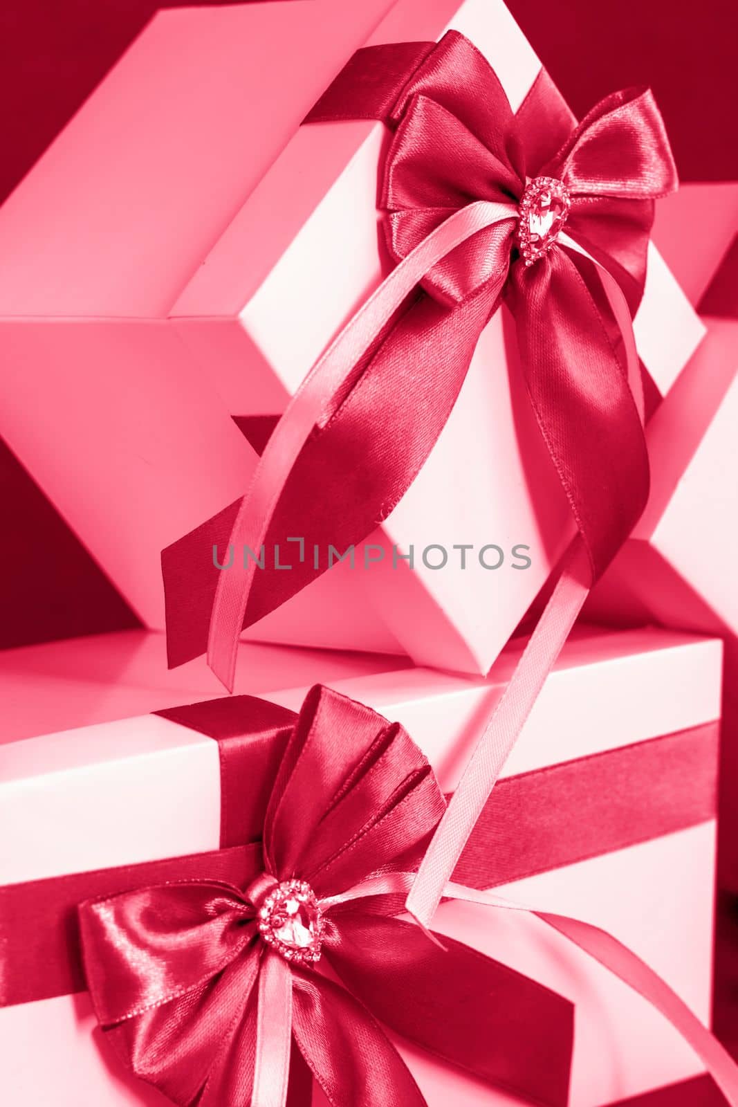 The gift box is white with a beautiful gray bow. Gift on a dark background. Holidays and surprises. Satin bows with rhinestones.	
Viva Magenta Background color