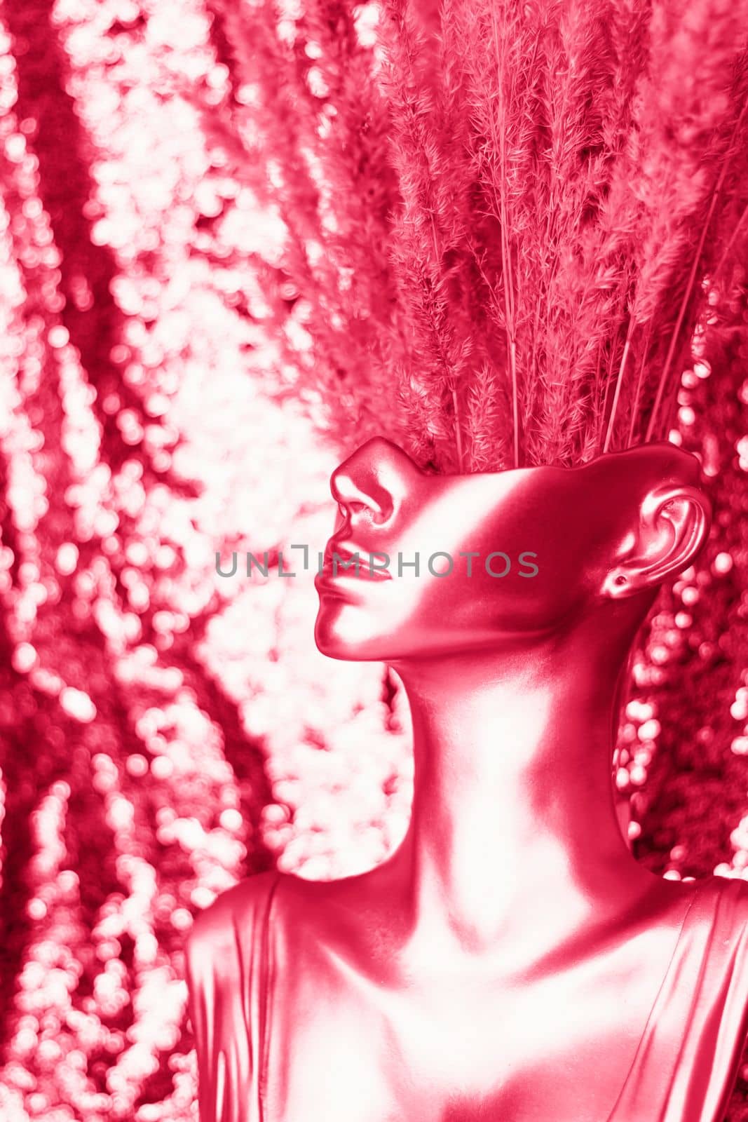 Female half-face with textured branches. golden figure, interior decoration.Viva Magenta Background color