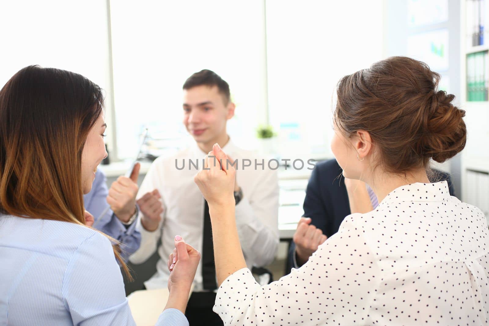 Group of business successful people sit in circle at team meeting by kuprevich