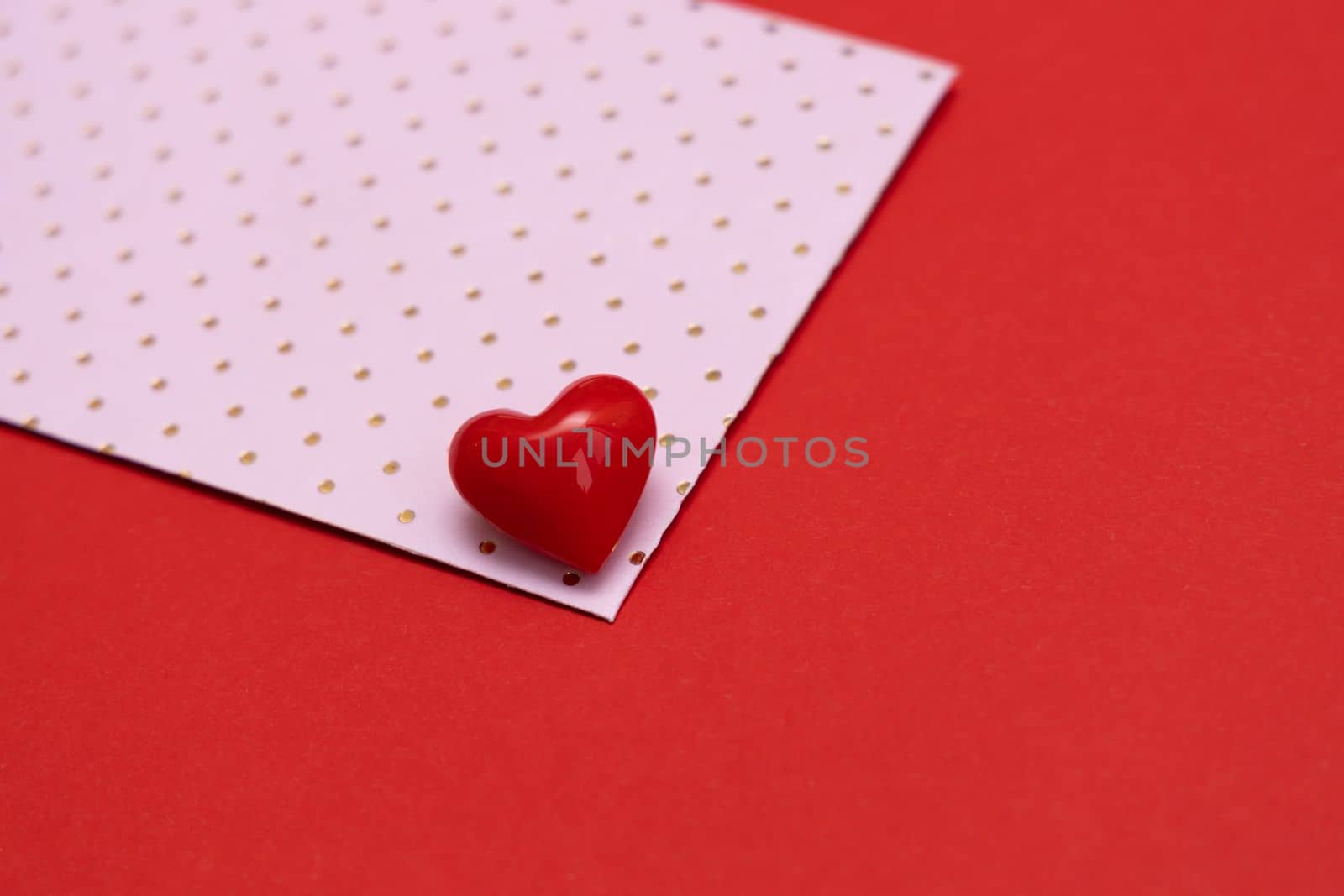 Valentines day red heart on same color background. Monochromatic vivid color. Valentine's day concept. Close up, copy space