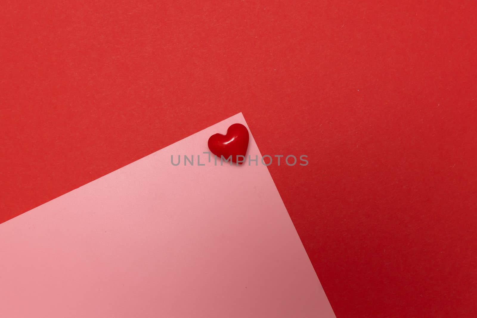 Valentines day red heart on same color background. Monochromatic vivid color. Valentine's day concept. Close up, copy space