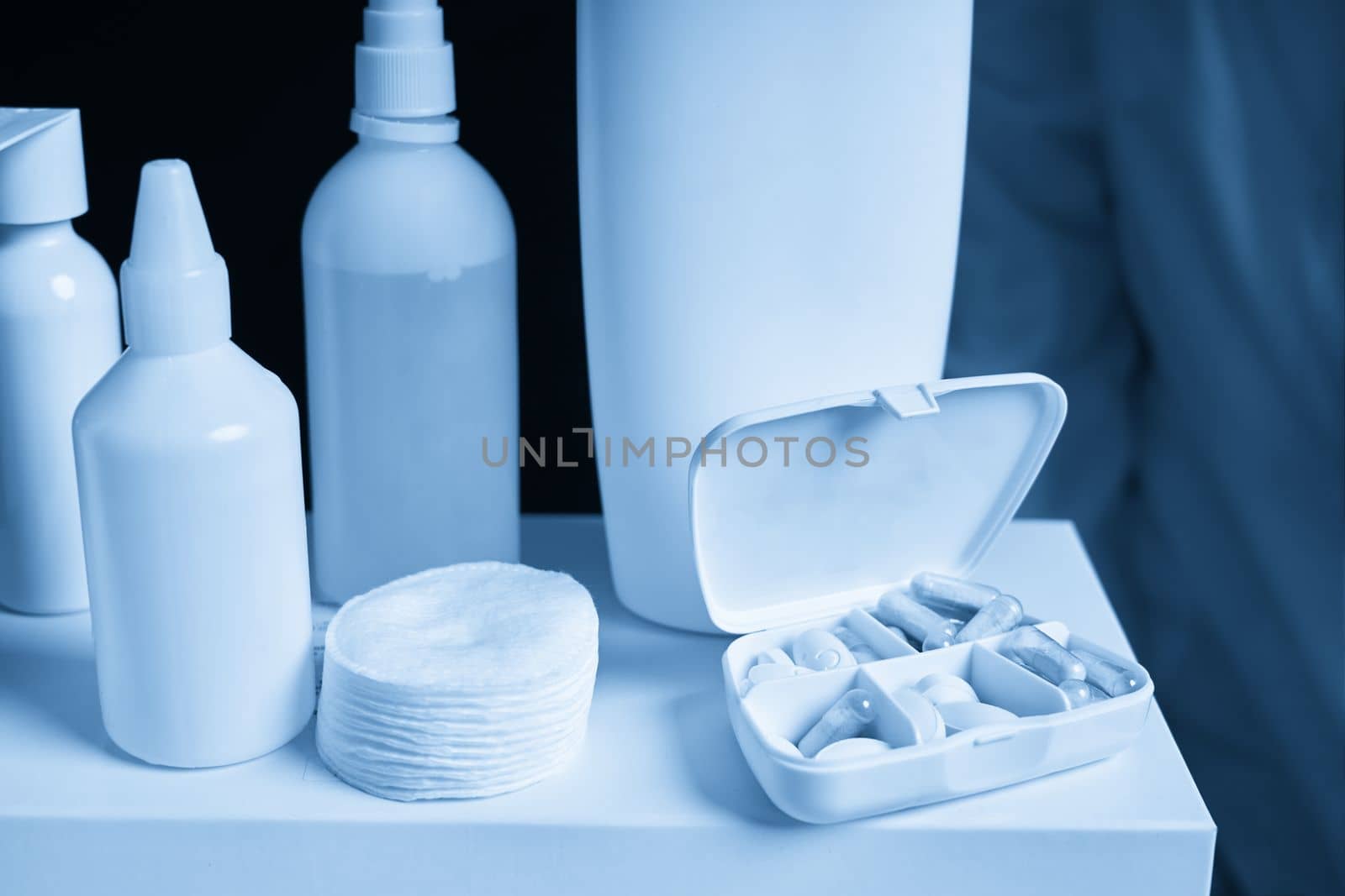 White box with many pills and Blank medicine bottles