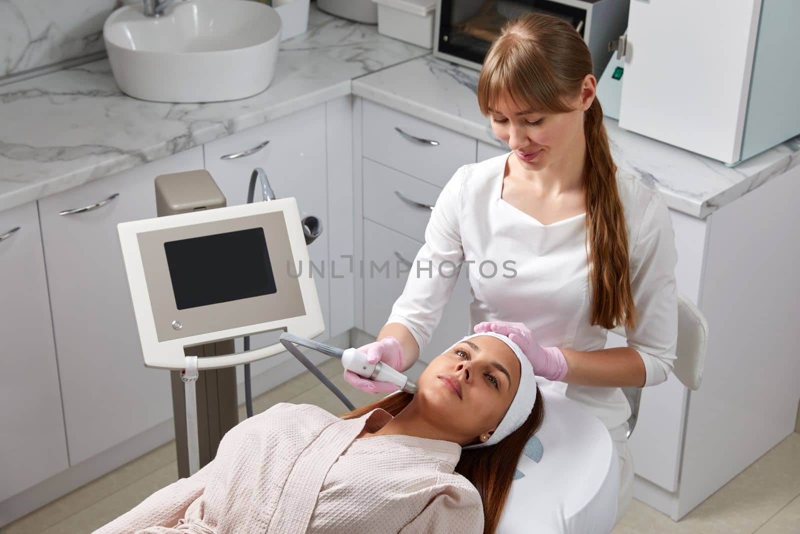 Face Skin Care. Close-up Of Woman Getting Facial Hydro Microdermabrasion Peeling Treatment At Cosmetic Beauty Spa Clinic. Hydra Vacuum Cleaner