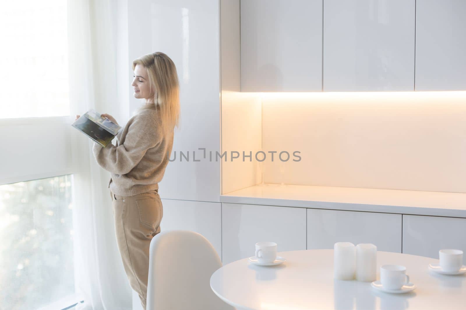 Happy Young Woman With Photo Album.