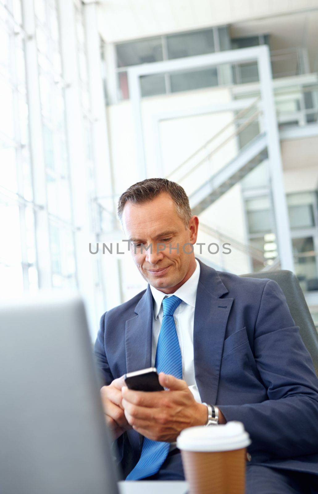 Ceo, mature businessman with smartphone and company communication or social media, working with laptop and coffee. Contact, online and email with networking and worker and professional man.