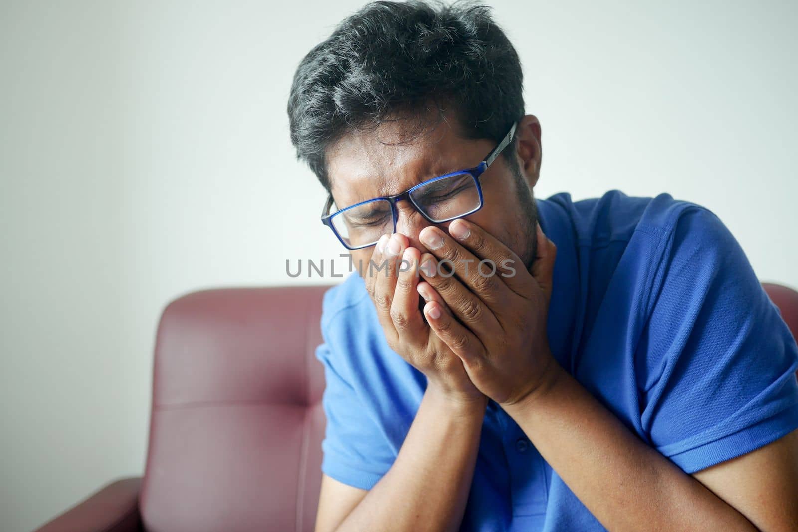 Portrait of sick man sneezes and coughs,