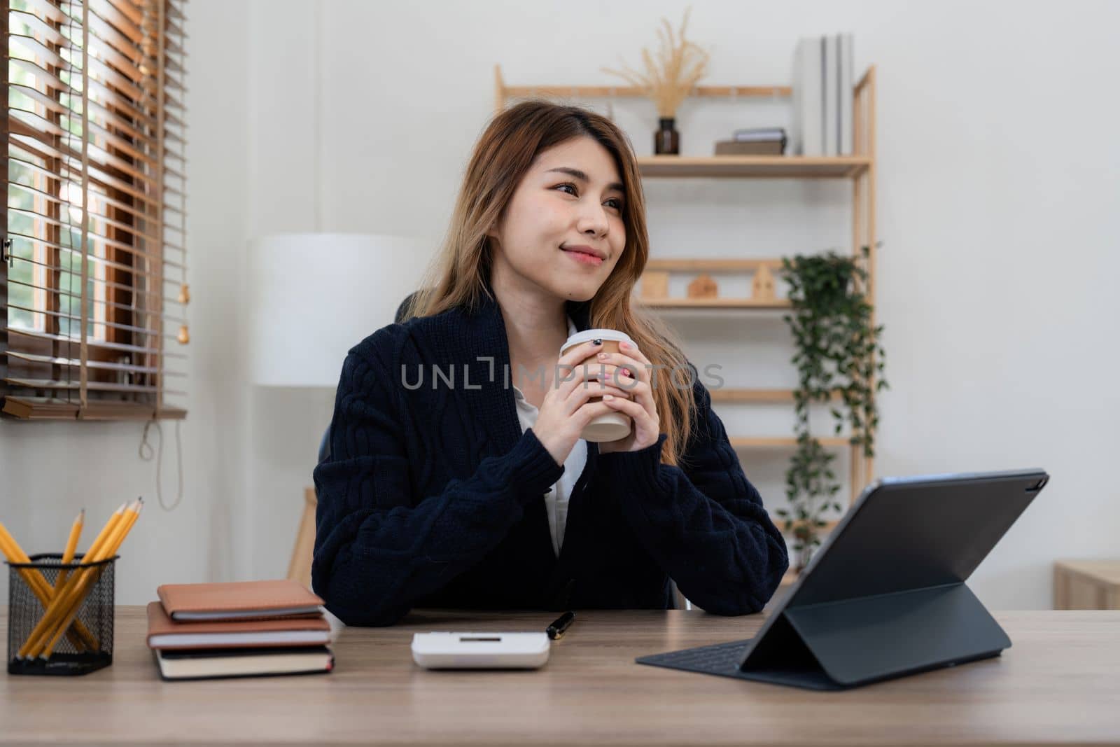 Asian woman working with laptop at home. work from home concept.
