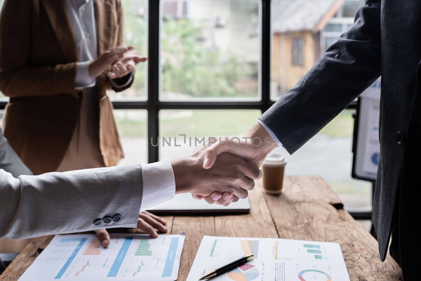 Business partnership meeting concept. Image businessmans handshake. Successful businessmen handshaking after good deal. Group support concept by itchaznong