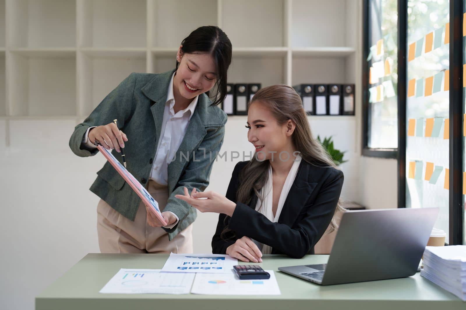 Group of business consultant working management big data and analyze financial document of company.