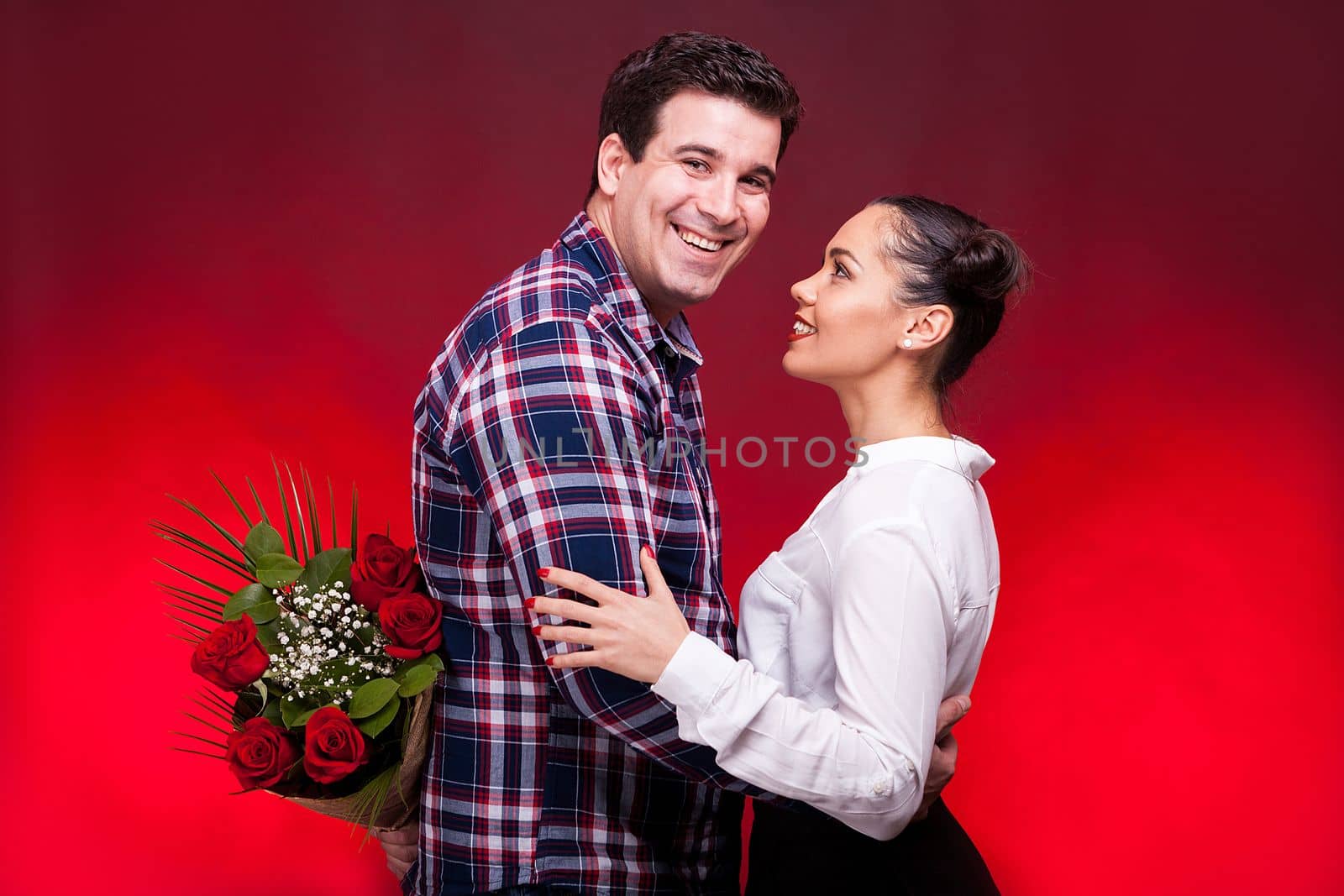 Man with a roses bouquet at his back on a first date by DCStudio