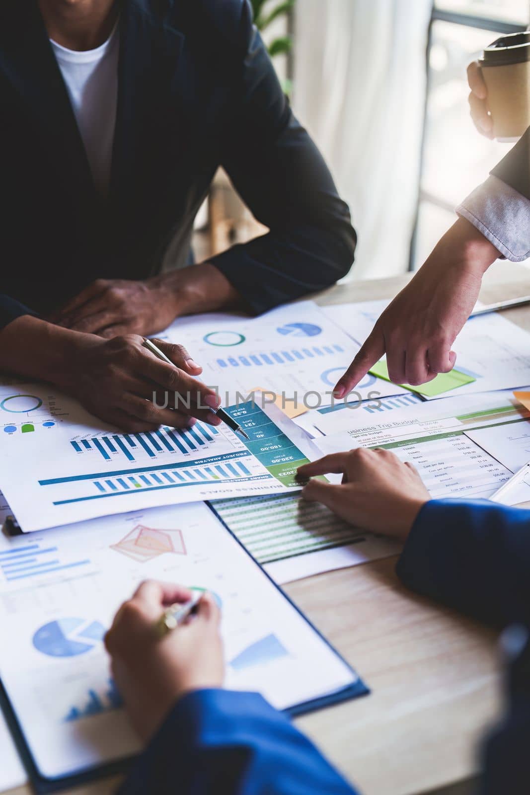 Close up Business team of financial analyze about company's graph profit. finance, strategy, meeting concept by itchaznong