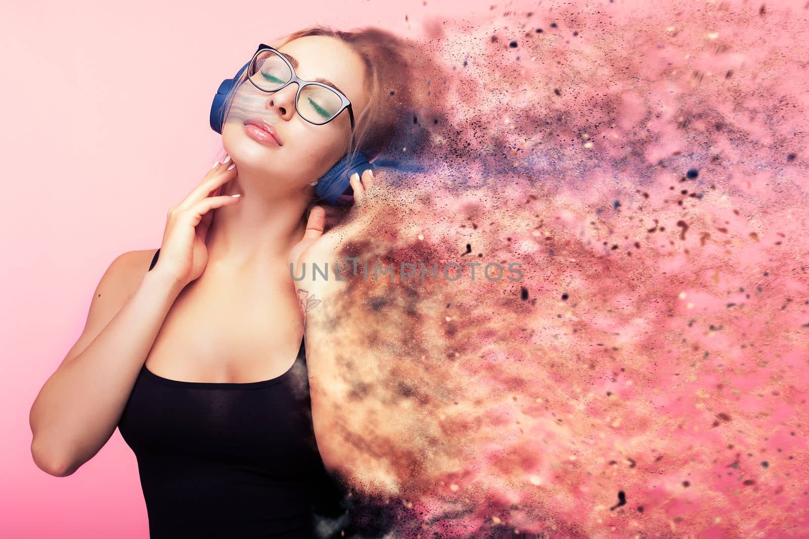 Conceptual image of woman listening to music while she is being by DCStudio