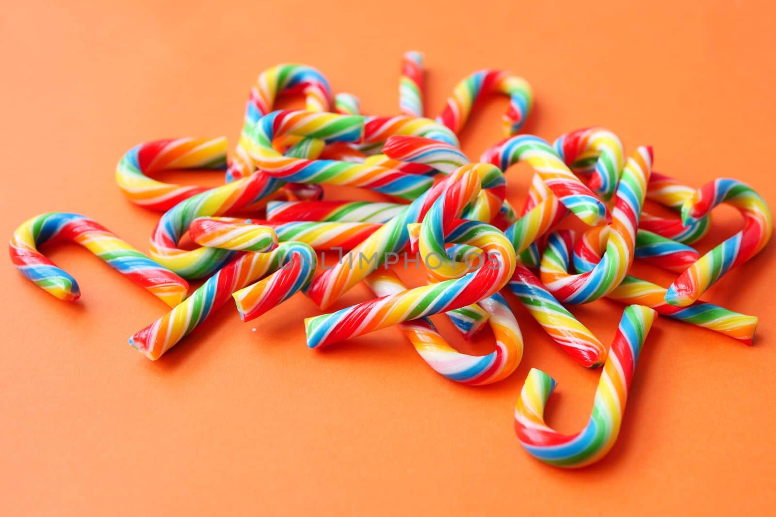 mini cherry candy canes on white background 