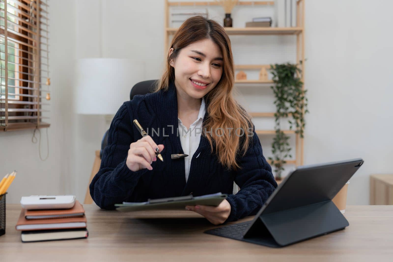 Asian woman working with laptop at home. work from home concept.