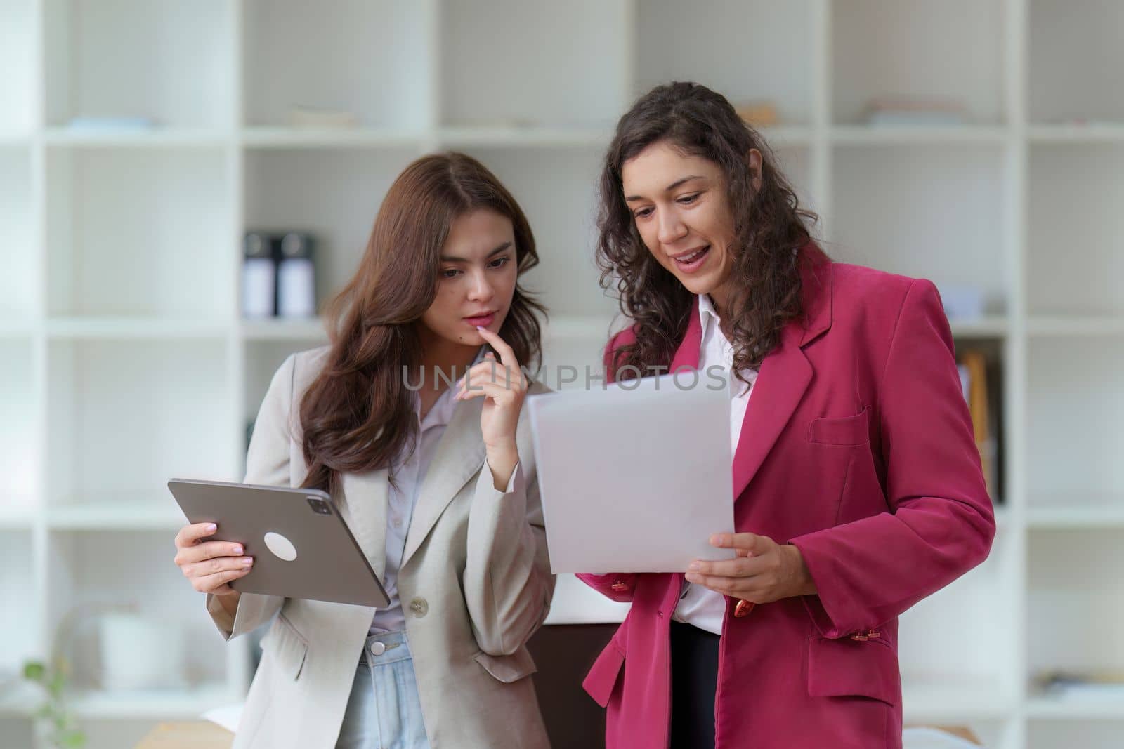 Business People Meeting to discuss and brainstorming the financial report paperwork in home office. Financial advisor teamwork and accounting concept.