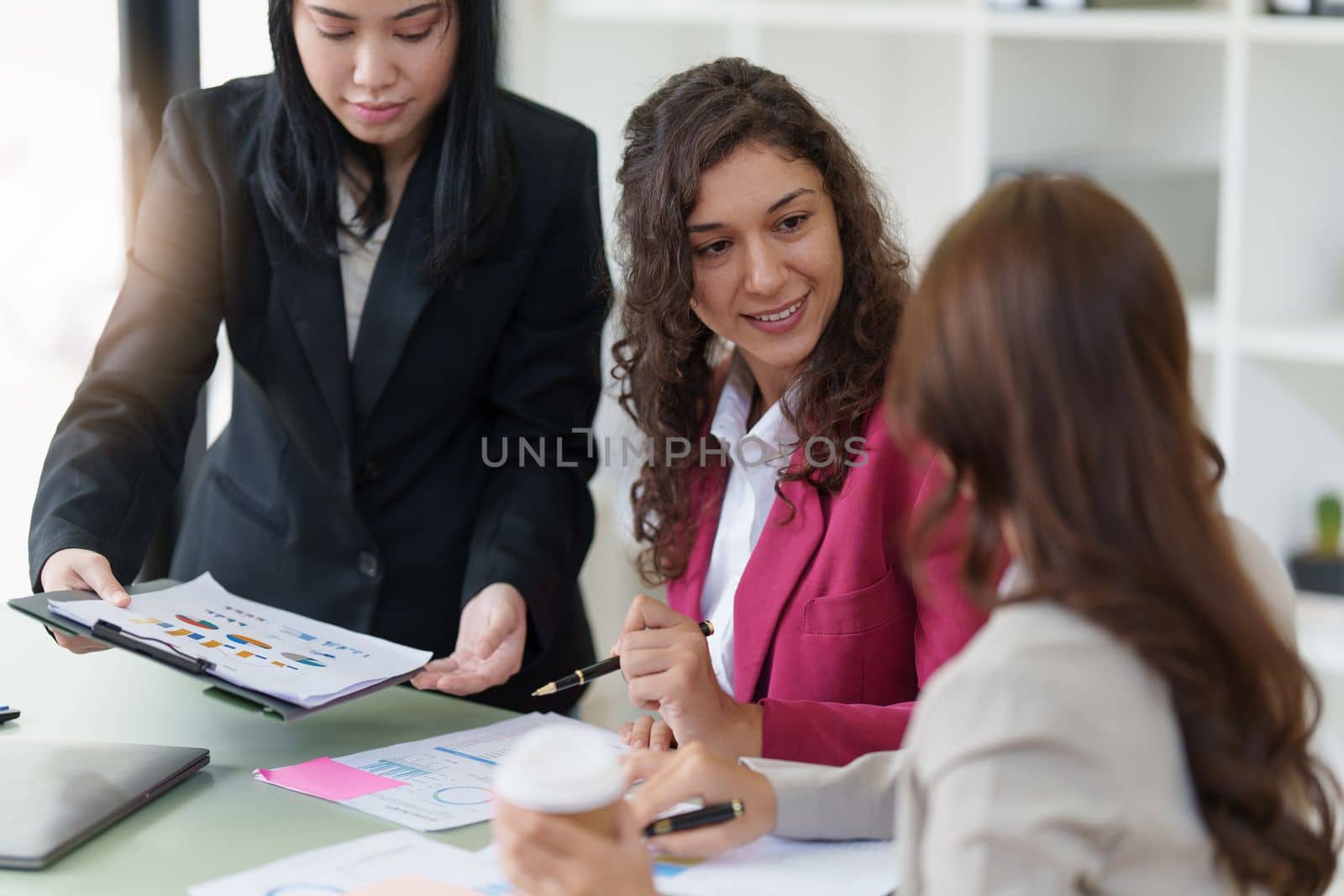 Business People Meeting to discuss and brainstorming the financial report paperwork in home office. Financial advisor teamwork and accounting concept.