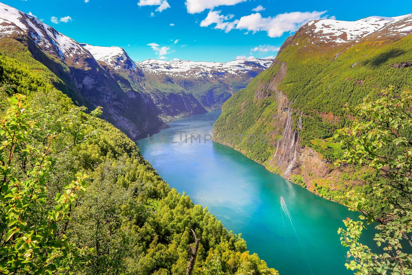 Peaceful Geirangerfjord with boat and waterfall, Norway , Nordic Countries