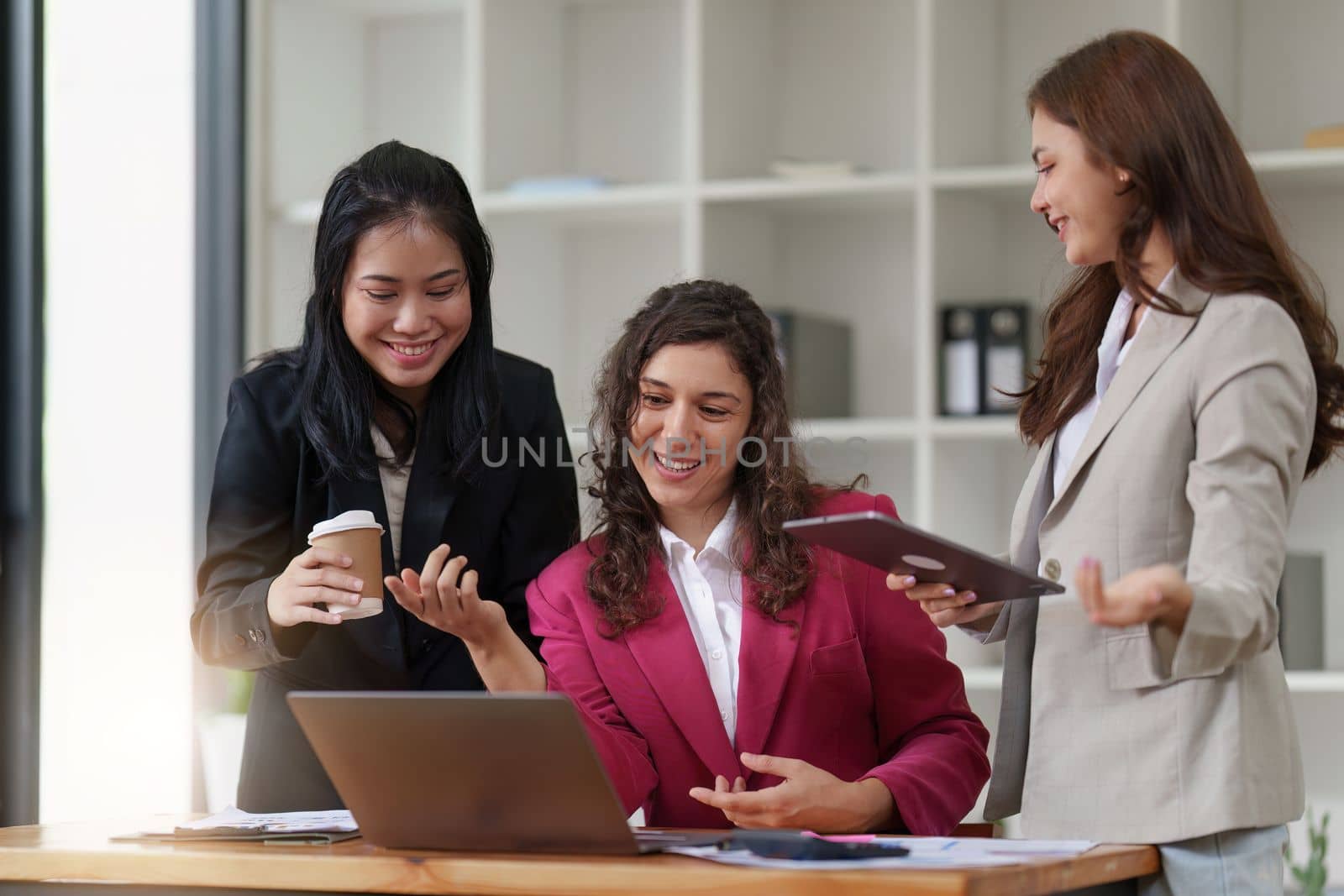 Business People Meeting to discuss and brainstorming the financial report paperwork in home office. Financial advisor teamwork and accounting concept.