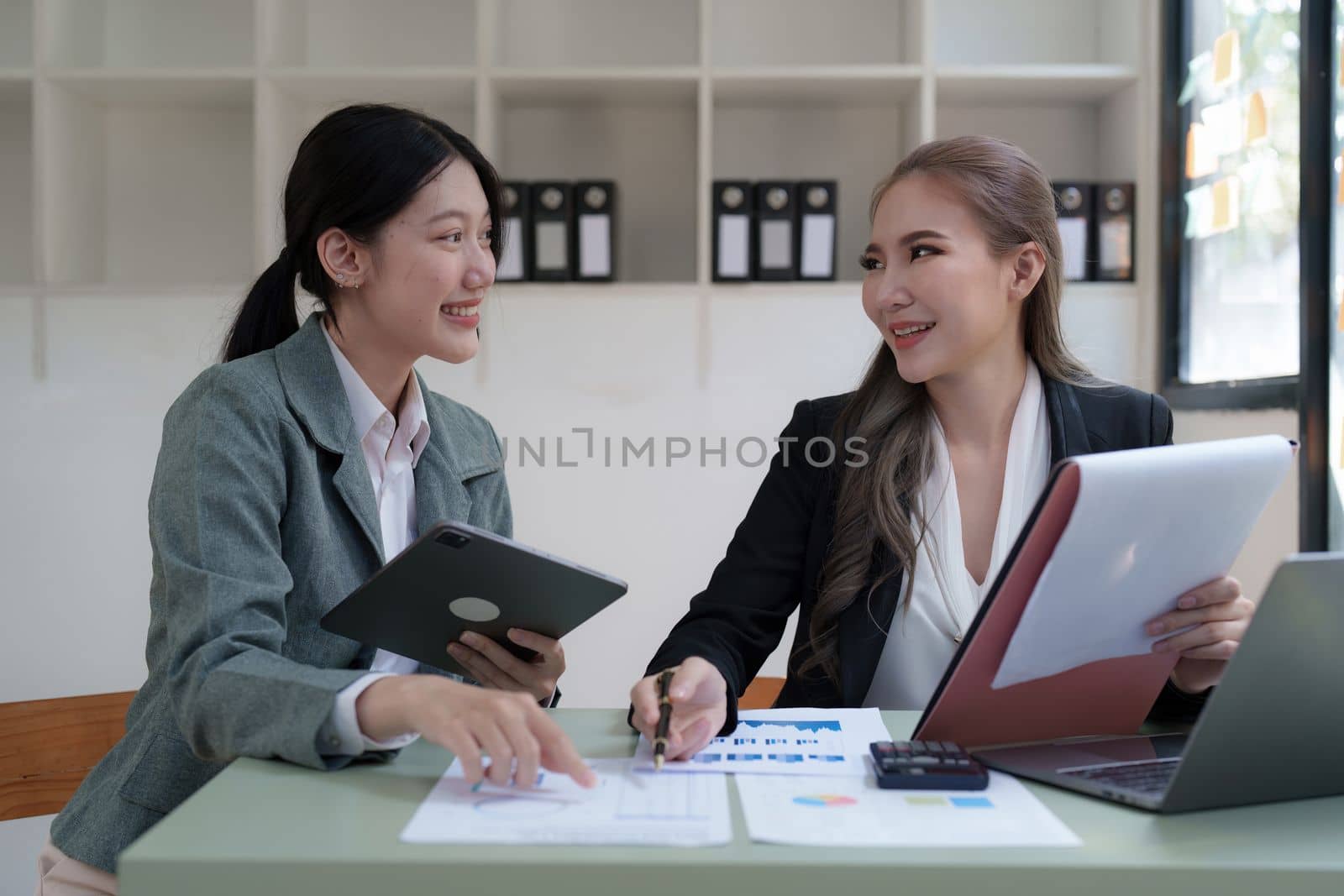 Group of business consultant working management big data and analyze financial document of company.