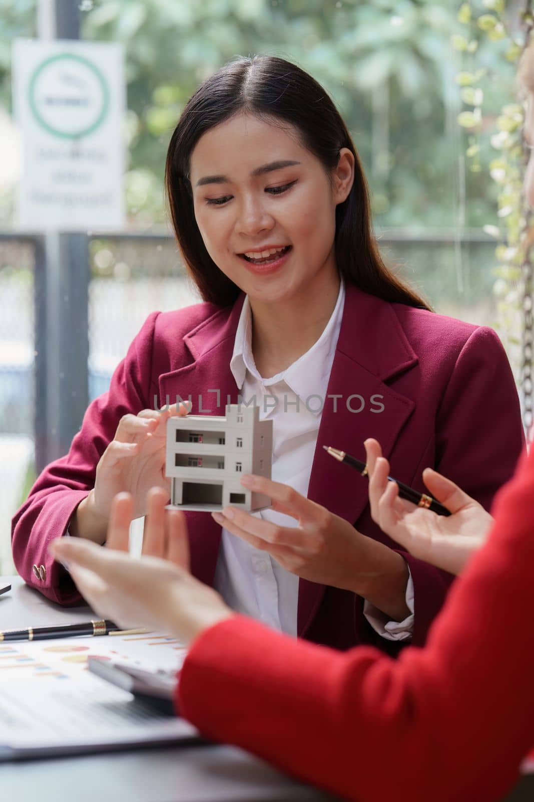 Real Estate Agent explain insurance and agreement contract to client before sign contract. Property insurance and security concept.