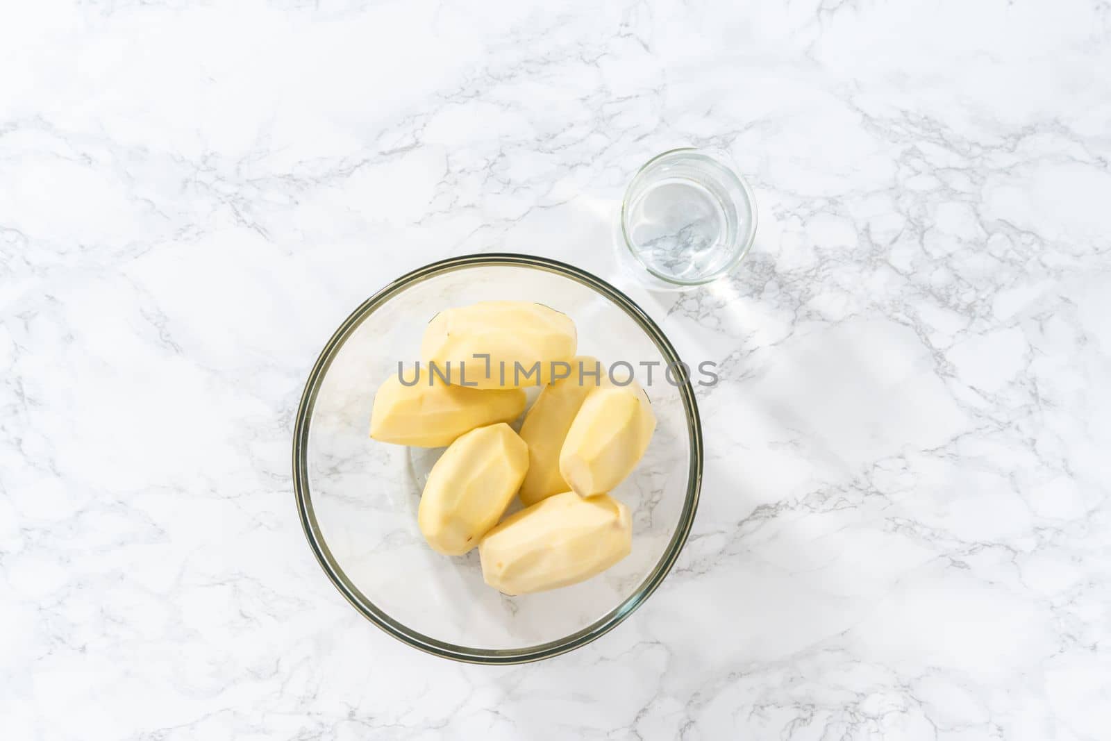 Flat lay. Mashed potatoes. Measured ingredients in glass mixing bowls to prepare mashed potatoes in a pressure cooker.