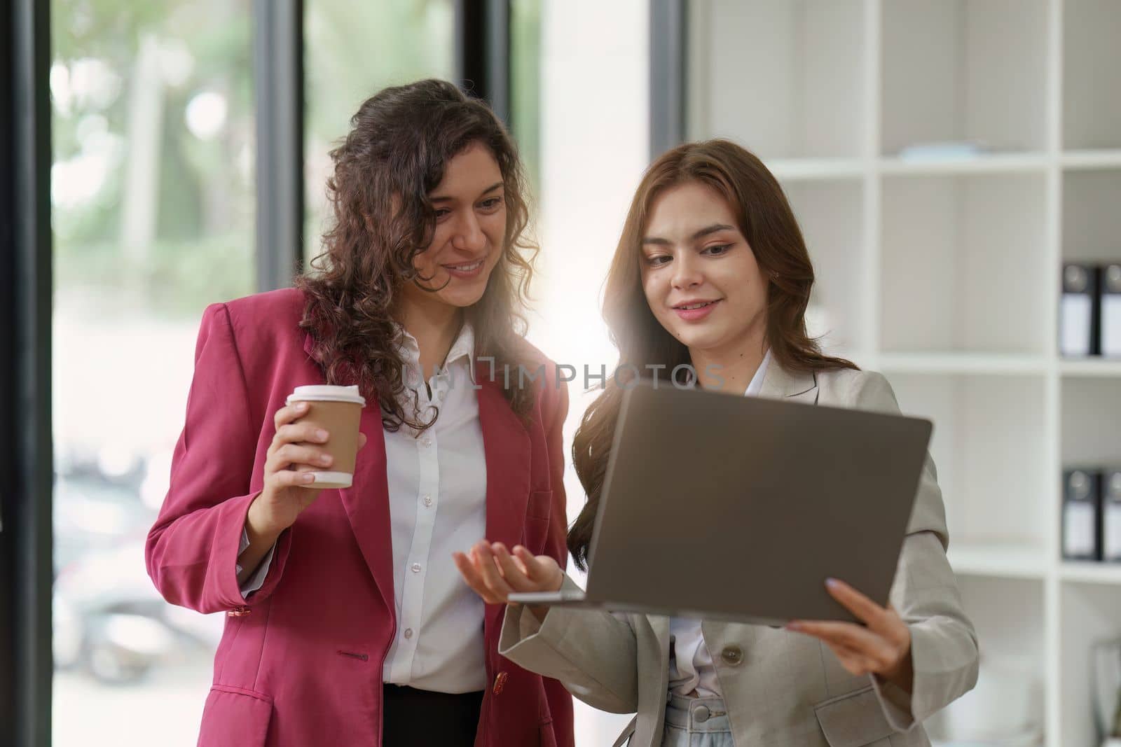 Business People Meeting to discuss and brainstorming the financial report paperwork in home office. Financial advisor teamwork and accounting concept.