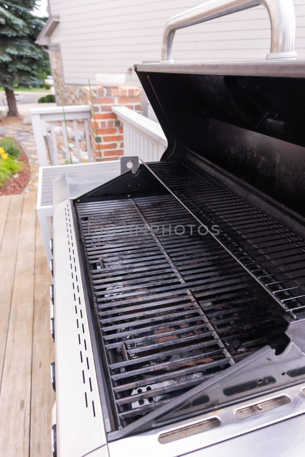 Clean six-burner gas grill ready for summer grilling.