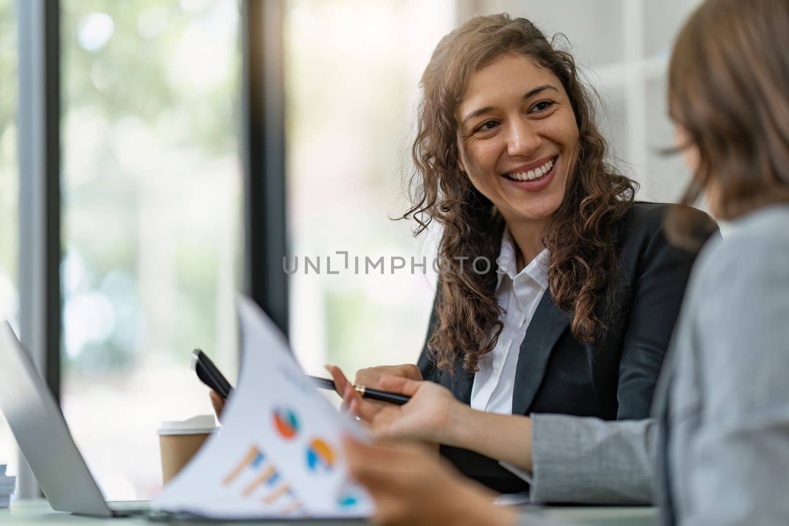 Business People Meeting to discuss and brainstorming the financial report paperwork in home office. Financial advisor teamwork and accounting concept.