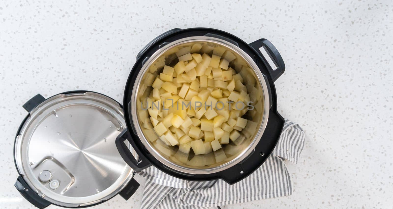 Flat lay. Cooking potatoes and eggs in a pressure cooker to make potato salad.