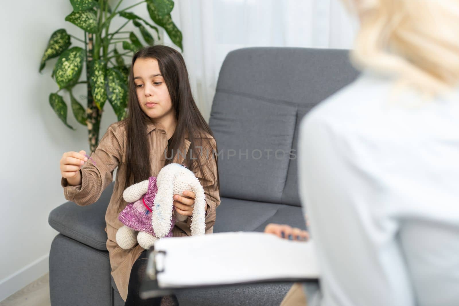 woman school psychologist communicates with a schoolgirl.