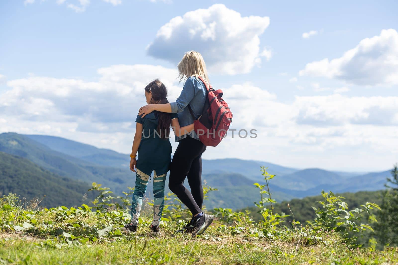Mother and Daughter enjoying the view after a mountain hike.