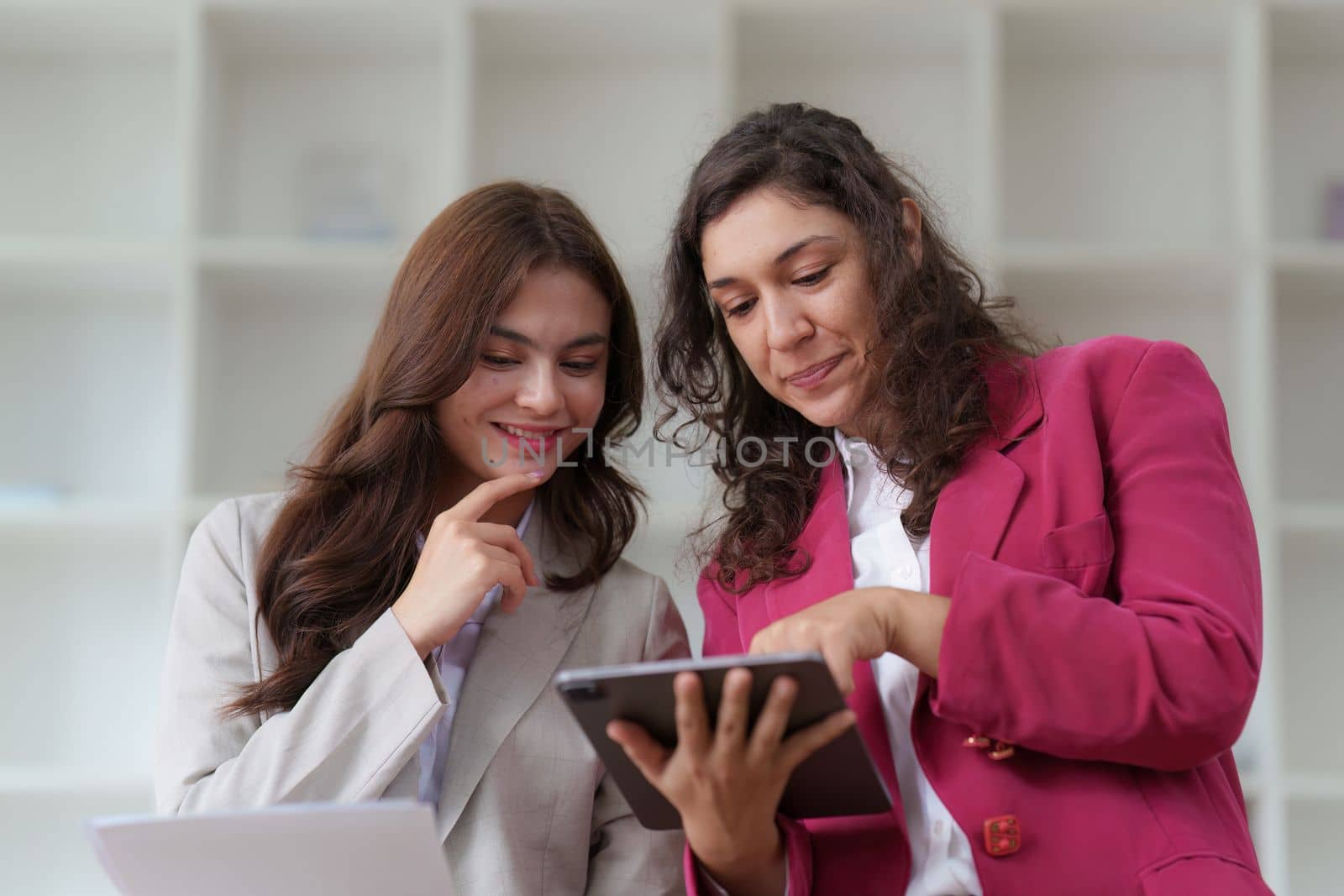 Business People Meeting to discuss and brainstorming the financial report paperwork in home office. Financial advisor teamwork and accounting concept.